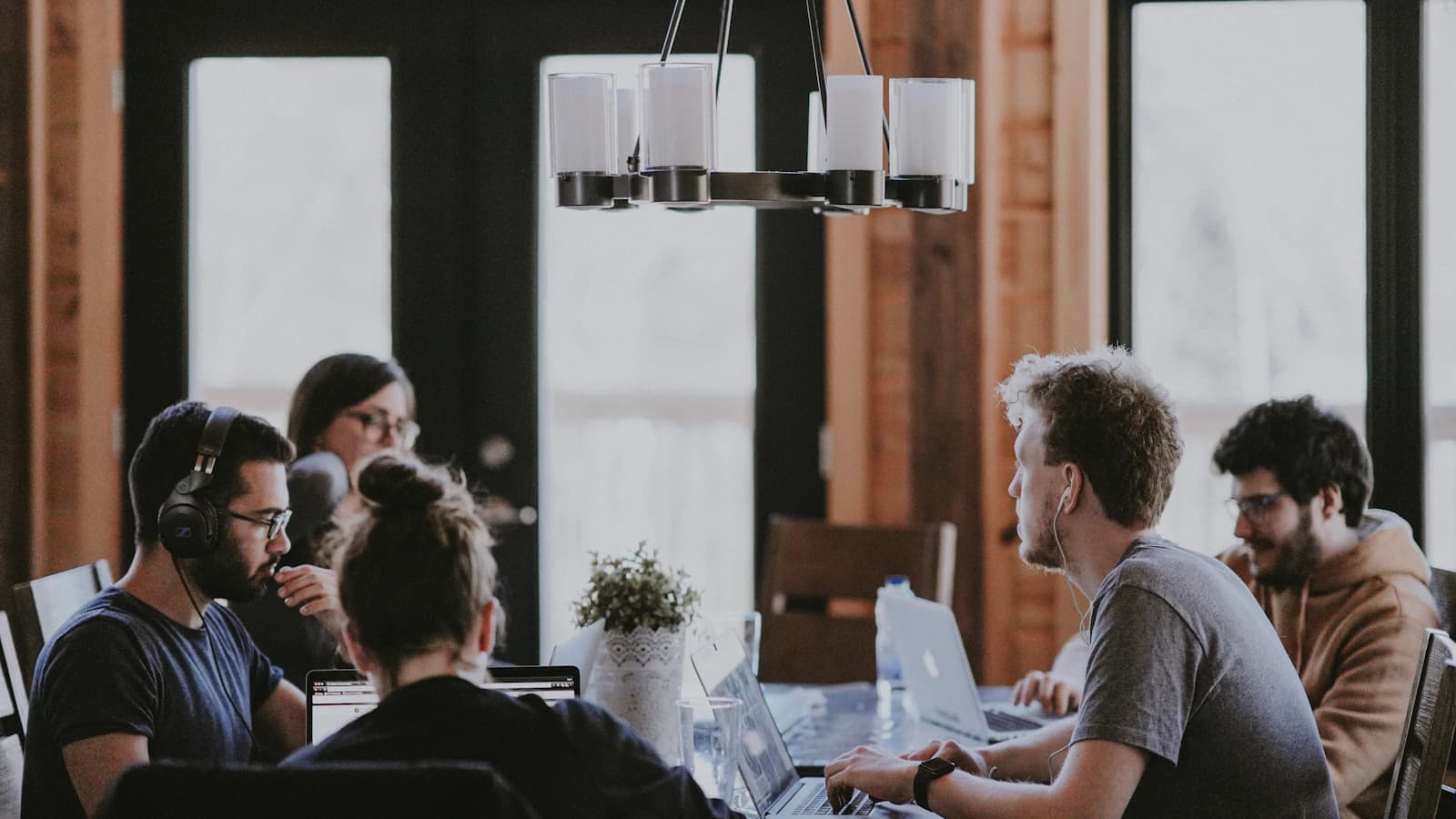 Team members working together around a shared office table